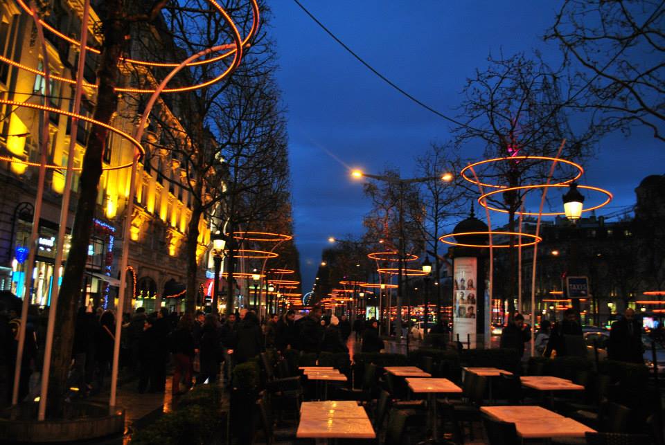 Paris by night - busy sidewalks