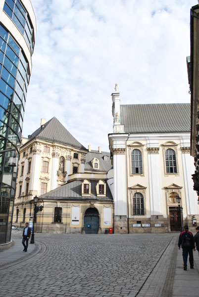 Glass building next to the Baroque-style University Museum in Wroclaw